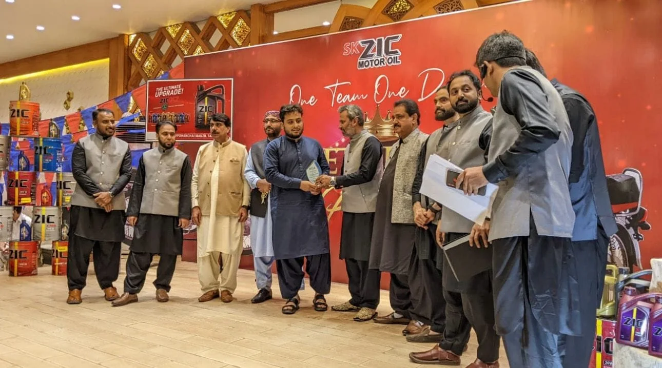 Khan Oil Works at an automotive industry event